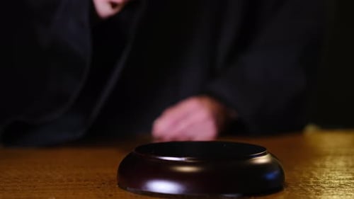 Judge Hitting Gavel in Courtroom for Justice