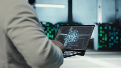 Server Room System Administrator Using Laptop to Do AI Automatization