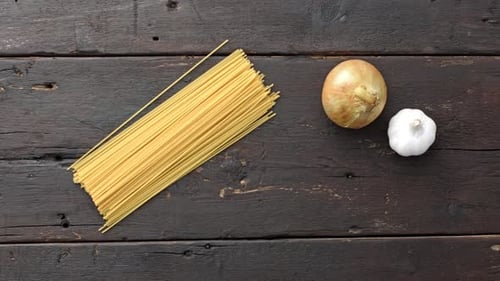 4k Time Lapse Of Woman Hands Placing Ingredients Of A Recipe Of Vegetarian Pasta On Kitchen Count...