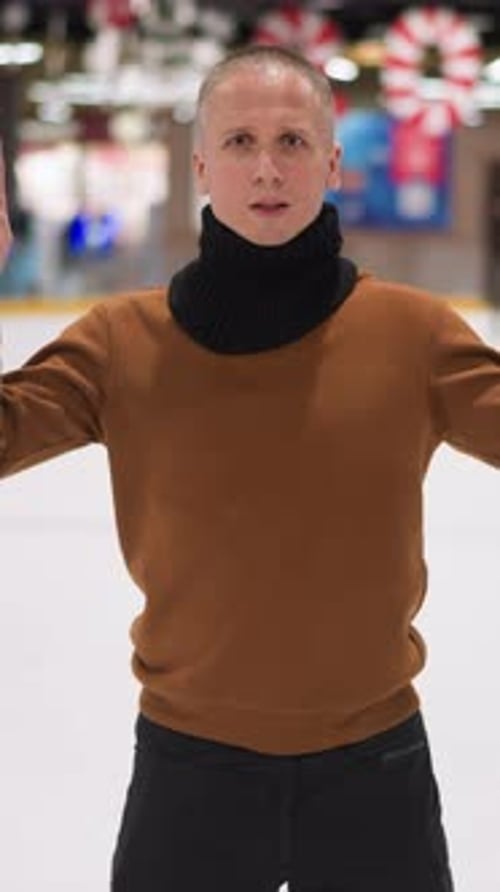 Adult Standing on Ice Rink in Portrait Video