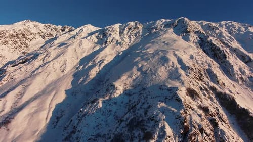 Aerial View of Snowy Mountains at Sunset Horizontal Panorama