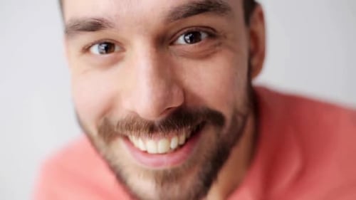 Emotion, Expression and People Concept - Happy Smiling Man with Beard Having