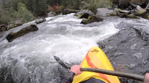 Whitewater kayaking the Class IV Natural Bridge section of the upper Rogue River in Southern Oregon