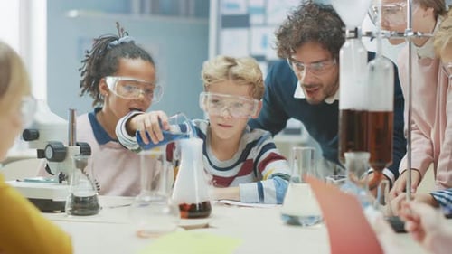 Elementary School Science Classroom: Enthusiastic Teacher Explains Chemistry to Diverse Group of Ch