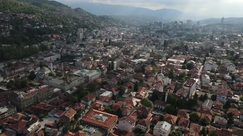 Aerial the view of the city of Sarajevo the capital of Bosnia with tile roofs historical buildings a