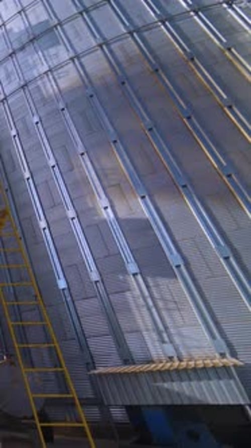 Tall Grain Silos on a Bright Sunny Day