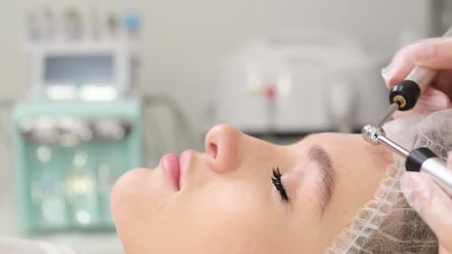 Woman Receiving Cosmetic Treatment on Forehead and Eyebrows