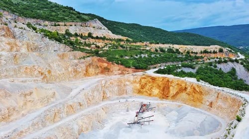 Natural Quarry is Located Near Road Against Backdrop of Rhodope Mountains and Hills with Forests and
