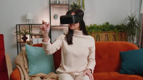 Young Woman Using Virtual Reality Headset on Couch