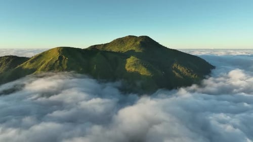 Aerial View of Mountains above the Clouds at Sunrise