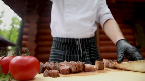 the chef prepares delicious meat in the restaurant