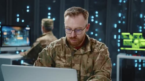 Data Center Military Services Bearded Soldier Using Computer Laptop Programming Cyber Security