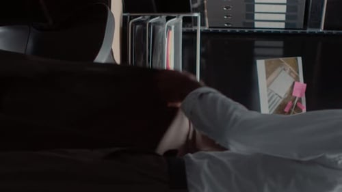 Man Examining Investigation Board at Office Desk