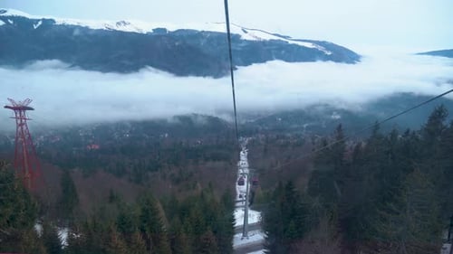 Above the Clouds Cable Car Ride Over Misty Valley and Forest