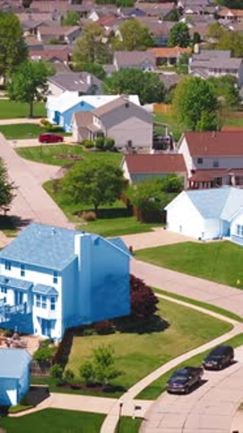 Aerial View of a US Neighborhood with Houses Colorcoded in Red and Blue Highlighting Republican