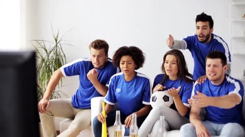 Friends Watch a Football Game Together at Home