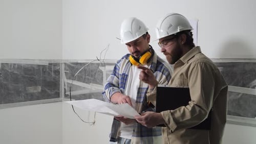 Engineers Inspect the Building on the Construction Site and Discuss the Drawings