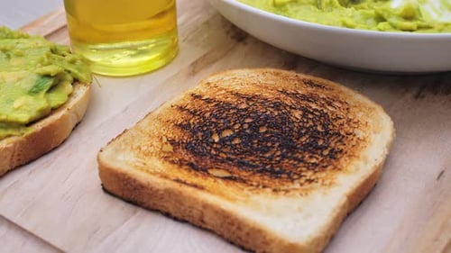 Making Avocado Toast With Knife Close Up