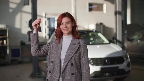 Portrait of Happy Female Client Rejoices at Car Repair and Maintenance Service at Technical Station
