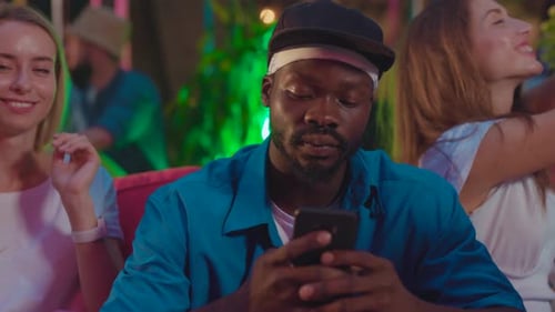 Young Adults Enjoying Drinks at Outdoor Party