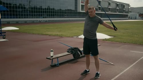 Man Training with Resistance Band Outdoors