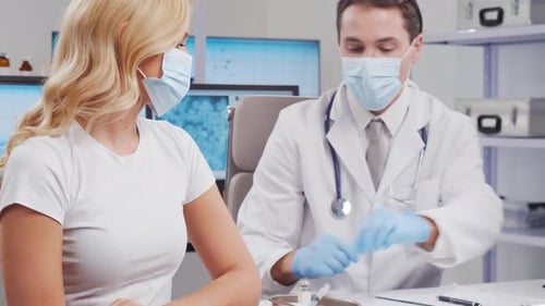 Doctor Giving Patient Vaccine Shot in Clinic