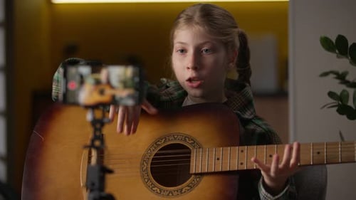 Child Sings and Plays Guitar for Vlog