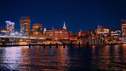 Low angle view from the riverscape. New York scenery at night.
