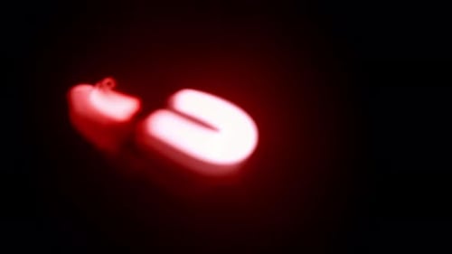 Fiery Red Light Trails on Black Background – Abstract Motion Graphic Loop