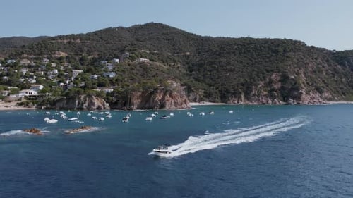 Drone Shot of Motorboat Sail Into Bay or Cove