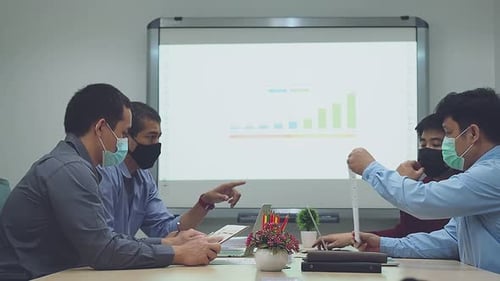 Adults In a Corporate Meeting With Face Masks