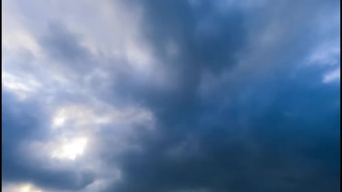 Overcast horizon from low angle view. Grey cloudscape spreading by the sky. Timelapse.