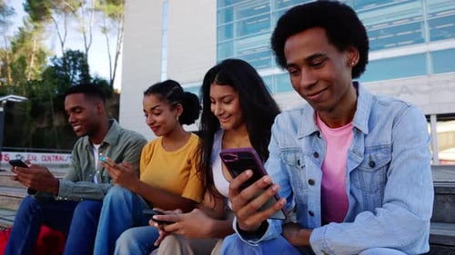 Young Adults Using Smartphones on University Campus