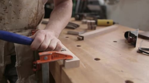 Carpenter in calgary alberta Canada uses chisel with skill and precision
