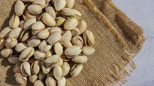 Pistachios in Shells on Burlap, Close Up