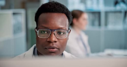 Close Up of Man Working at Computer