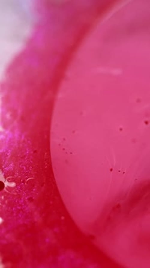 Abstract Red Liquid with White Balls and Particles