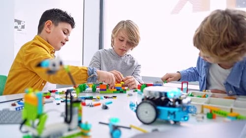 Robotics Programming Class Children Construct and Code Robot STEM Education Using Constructor Blocks