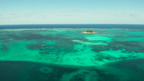 Tropical Guyam Island with a Sandy Beach and Tourists