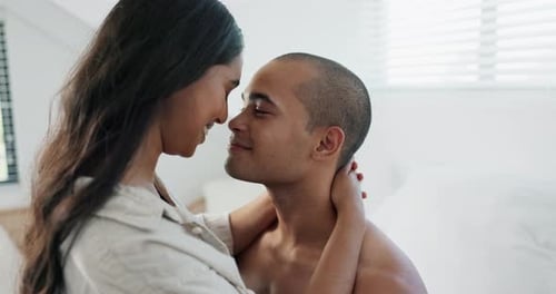 Loving Couple Embracing in Bedroom