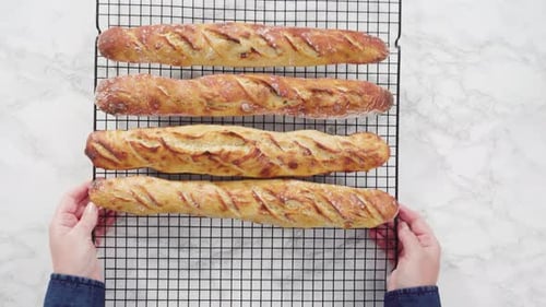 Freshly Baked Baguettes Cooling on Wire Rack