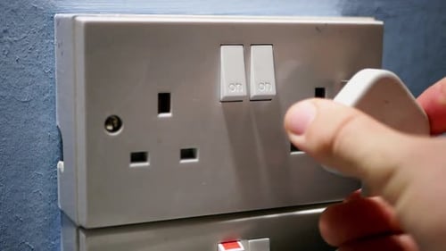 Plugging in Electric Socket in the Home