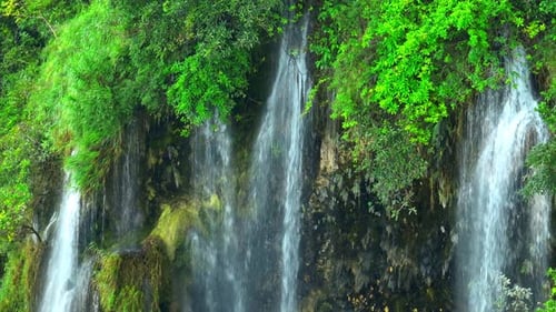 Beautiful waterfall in a tropical forest by aerial view from a drone.