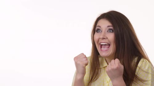 Excited Brunette Woman Celebrating Success on White Background