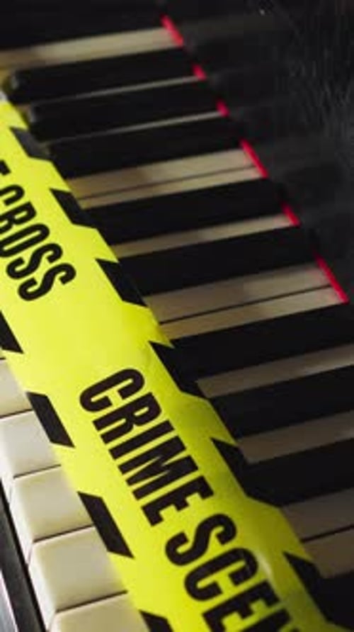 Piano Keys Covered with Crime Scene Tape