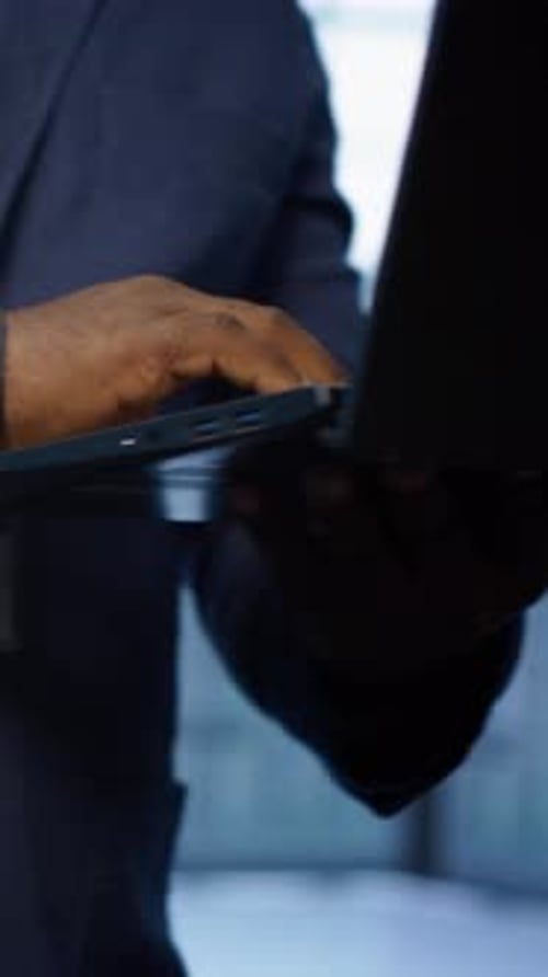 Vertical Video Close Up of IT Professional in Data Center Fixing Errors