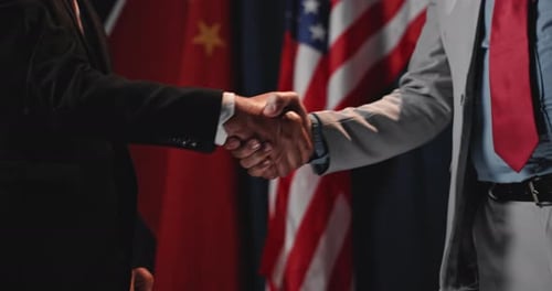 Handshake Between Two People With National Flags