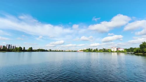 Panoramic view of the lake and blue sky with clouds.