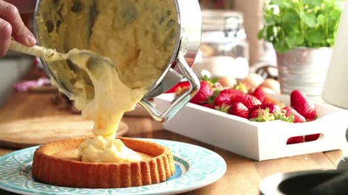Custard Cream Filling Being Poured Into A Tart Crust
