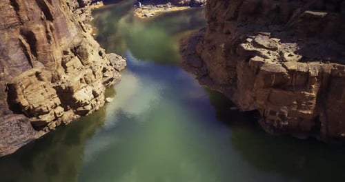 Stunning View of a River Winding Through Rugged Cliffs in Daylight